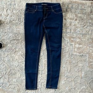 Maurice’s dark blue skinny jeans, medium rise size medium regular.